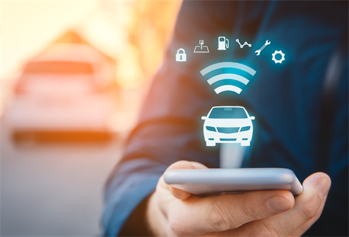 A smartphone being used to remotely control a car via Wi-Fi, illustrating the cybersecurity risks of connected and autonomous vehicles.