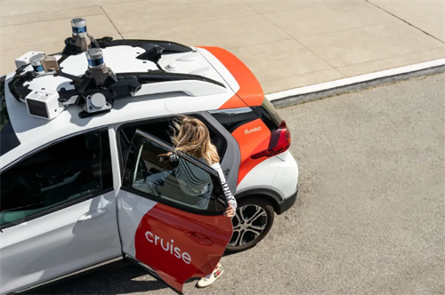 A passenger exiting a Cruise autonomous vehicle, illustrating the user experience of robotaxi services.